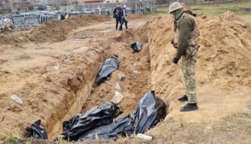 В Киевской области обнаружили восемь массовых захоронений мирных жителей, убитых россиянами